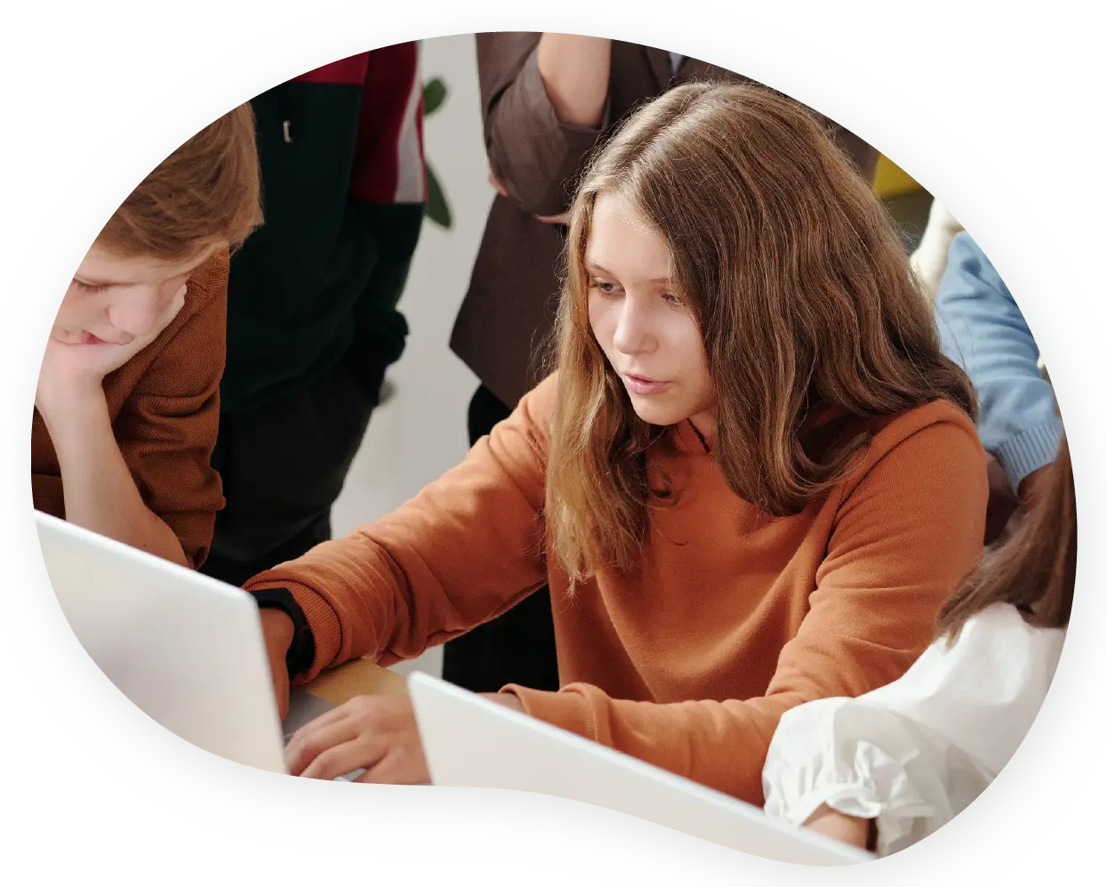 A student interacting with their laptop